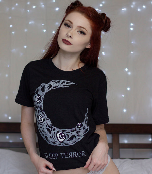 Sleep Terror Clothing Dead Moon T-shirt | Black occult t-shirt for women featuring a distressed crescent moon design covered in craters and creepy eyeballs